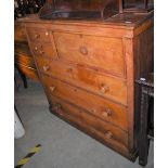 A 19TH CENTURY MAHOGANY CHEST FITTED WITH TWO SMALL DRAWERS FLANKED BY A DEEP DRAWER OVER THREE LONG