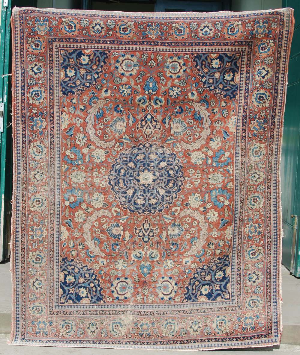 AN ANTIQUE PERSIAN CARPET, THE MADDER FIELD WITH PALMETTES AND SCROLLING FLORAL ARABESQUES WITH A - Image 2 of 9