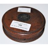 A 19TH CENTURY CIRCULAR OAK BOX AND COVER WITH WHITE METAL PLAQUE, INSCRIBED 'MADE FROM THE RUINS OF