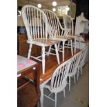A WHITE-PAINTED VICTORIAN STYLE REFECTORY TABLE WITH FIVE WHITE-PAINTED SPINDLE-BACK CHAIRS AND