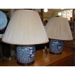 A PAIR OF BLUE AND WHITE CHINESE LIDDED GINGER JARS, CONVERTED TO TABLE LAMPS WITH SHADES