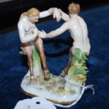 A MINIATURE MEISSEN PORCELAIN FIGURE OF MALE AND FEMALE SATYRS SPARRING, BLUE CROSS MARKS, 7.5CM