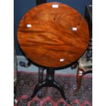 A 19TH CENTURY MAHOGANY SNAP-TOP CIRCULAR OCCASIONAL TABLE ON BALUSTER TURNED COLUMN WITH THREE