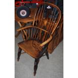 A 19TH CENTURY HIGH BACK WINDSOR ARMCHAIR