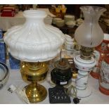 A BLACK PAINTED METAL AND GREEN GLASS PARAFFIN BURNING OIL LAMP, TOGETHER WITH TWO OTHER TABLE