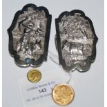 A PAIR OF EASTERN WHITE METAL BUCKLES TOGETHER WITH TWO YELLOW METAL COINS