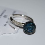 A 9CT WHITE GOLD, WHITE AND BLUE DIAMOND BALL SHAPED RING, THE BALL SET WITH ONE HUNDRED AND FORTY