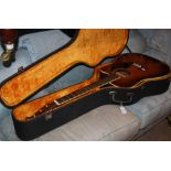 A SUZUKI MAGOYA GUITAR IN ORIGINAL FITTED BLACK CASE