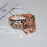 A 9CT ROSE GOLD GALILEA MORGANITE RING, CENTRED WITH AND OVAL CUT GALILEA MORGANITE ESTIMATED TO