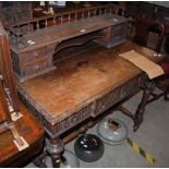 A LATE 19TH / EARLY 20TH CENTURY STAINED WOOD WRITING DESK, THE UPRIGHT BACK FITTED WITH FOUR