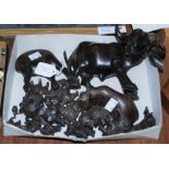 A COLLECTION OF CARVED WOODEN ANIMALS TO INCLUDE OXEN, HIPPOPOTAMUS ETC