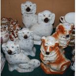 A PAIR OF POTTERY DOGS WITH TAN COLOURED MARKINGS AND INLAID EYES, TOGETHER WITH TWO PAIRS OF