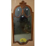 AN EARLY 20TH CENTURY PINE FRAMED WALL MIRROR OF RECTANGULAR FORM WITH FOLIATE CARVED CREST AND