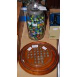 A GLASS JAR CONTAINING ASSORTED MARBLES AND TWO GRADUATED SOLITAIRE BOARDS