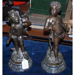 A PAIR OF BRONZED SPELTER FIGURE GROUPS AFTER MOREAU, THE FIRST TITLED "DENICHEUSE", THE SECOND "