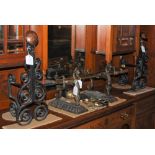 A PAIR OF CAST METAL SCROLL FORM ANDIRONS, A PAIR OF CAST METAL ANDIRONS OF STYLISED DRAGON FORM,