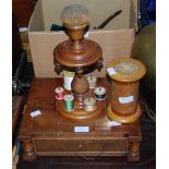 SEWING INTEREST - A MAHOGANY TABLE TOP THREAD HOLDER / COMBINATION PIN CUSHION, TOGETHER WITH AN