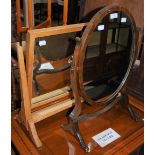 A MAHOGANY OVAL DRESSING TABLE MIRROR, TOGETHER WITH A RECTANGULAR OAK DRESSING TABLE MIRROR