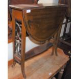 AN EDWARDIAN MAHOGANY INLAID SUTHERLAND TABLE