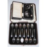 A CASED SET OF TWELVE EDINBURGH SILVER TEASPOONS, BROOK & SON, TOGETHER WITH A CASED PAIR OF