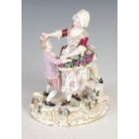 A LATE 19TH / EARLY 20TH CENTURY DRESDEN PORCELAIN FIGURE GROUP, MODELLED WITH FEMALE GRAPE PICKER