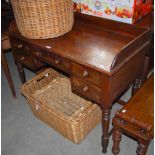 A 19TH CENTURY MAHOGANY DESK FITTED WITH DRAWERS, RAISED ON FOUR TURNED SUPPORTS UNITED BY