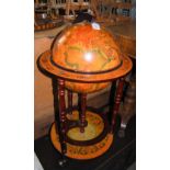 A DRINKS TROLLEY IN THE FORM OF A GLOBE ON STAND