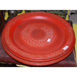 THREE ASSORTED EASTERN RED LACQUER CIRCULAR TRAYS