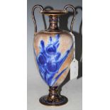 A DOULTON BURSLEM BLUE AND WHITE TWIN HANDLED POTTERY URN WITH GILDED DECORATION