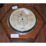 AN OAK HEXAGONAL BAROMETER BY S&M, MODEL STORMGUIDE