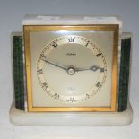 AN EARLY 20TH CENTURY ONYX AND GILT METAL MANTLE CLOCK BY ELLIOT, RETAILED BY ASPREY