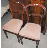 A PAIR OF VICTORIAN ROSEWOOD BALLOON-BACK SIDE CHAIRS WITH FOLIATE UPHOLSTERED SEATS