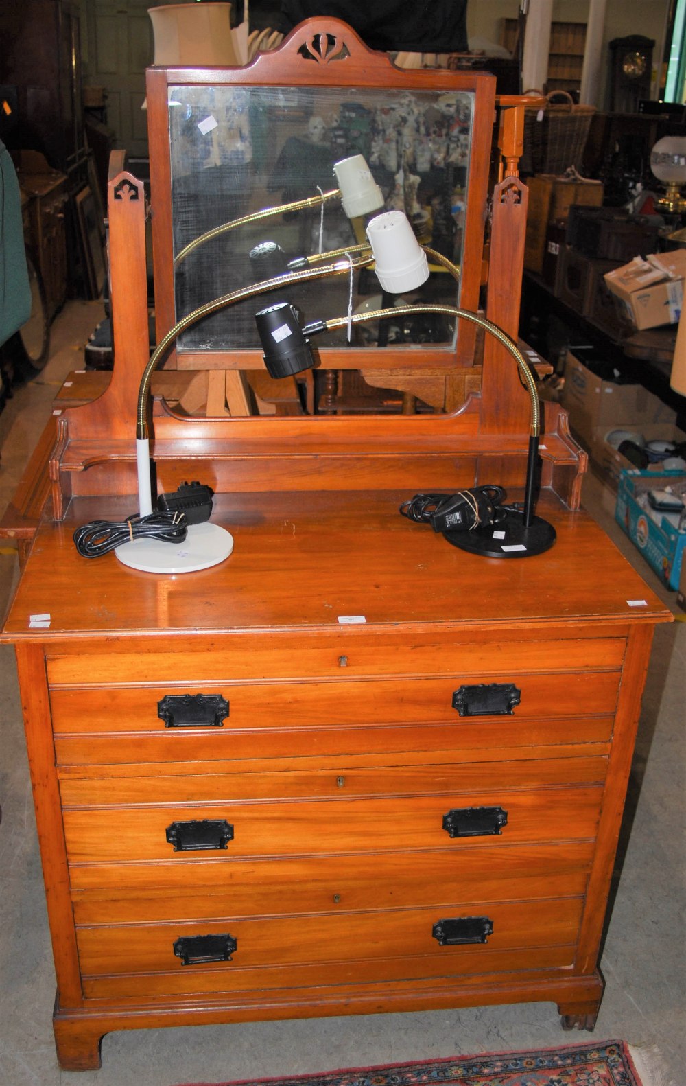 AN EARLY 20TH CENTURY MIRROR-BACK CHEST OF THREE DRAWERS