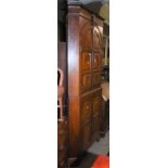 A MAHOGANY TWO-PART CORNER CUPBOARD, THE UPPER SECTION WITH PAIR OF ARCHED PANELLED DOORS ON A