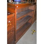 A LATE 19TH/ EARLY 20TH CENTURY STAINED OAK OPEN BOOKCASE WITH THREE ADJUSTABLE SHELVES
