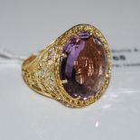 A 9CT GOLD BRAZILIAN AMETHYST 'AREZZO D'ORO' RING, SET WITH ROUND FACETED BRAZILIAN AMETHYST