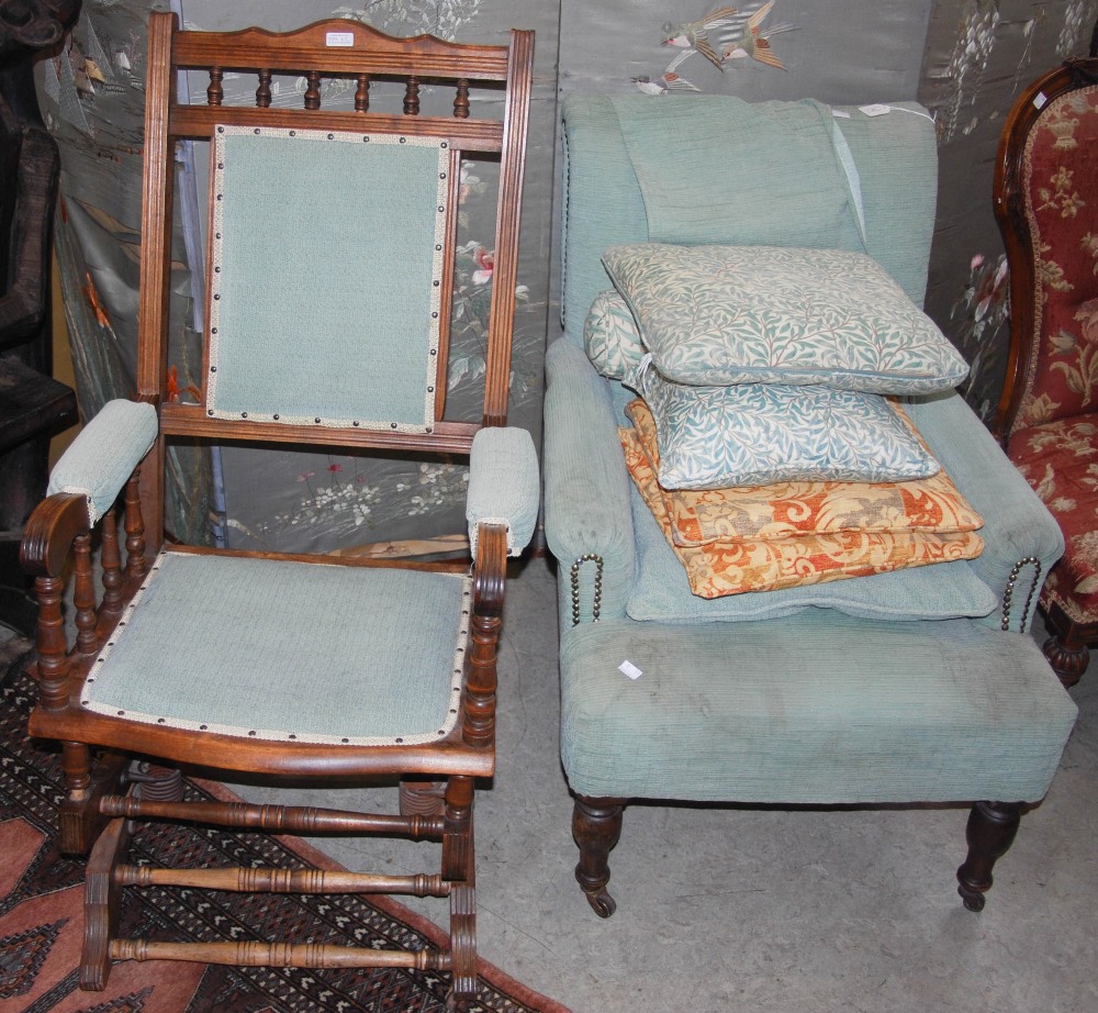 A BEECH WOOD ROCKING CHAIR WITH UPHOLSTERED BACK, ARMS AND SEAT TOGETHER WITH A SIMILARLY