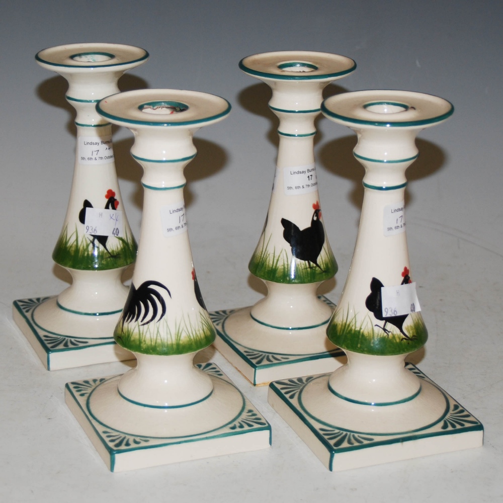 SET OF FOUR GRISELDA HILL POTTERY CANDLESTICKS DECORATED WITH BLACK COCKERELS