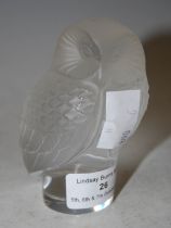 A LALIQUE CLEAR AND FROSTED GLASS MODEL OF AN OWL.
