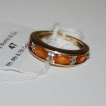 A 9CT GOLD GALISCO FIRE OPAL AND SRI LANKAN WHITE SAPPHIRE RING, SET WITH FOUR VARIOUS OVAL CUT