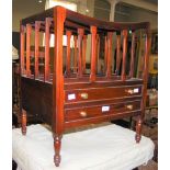 A MAHOGANY FOUR DIVISION CANTERBURY WITH TWO DRAWERS AND BRASS HANDLES