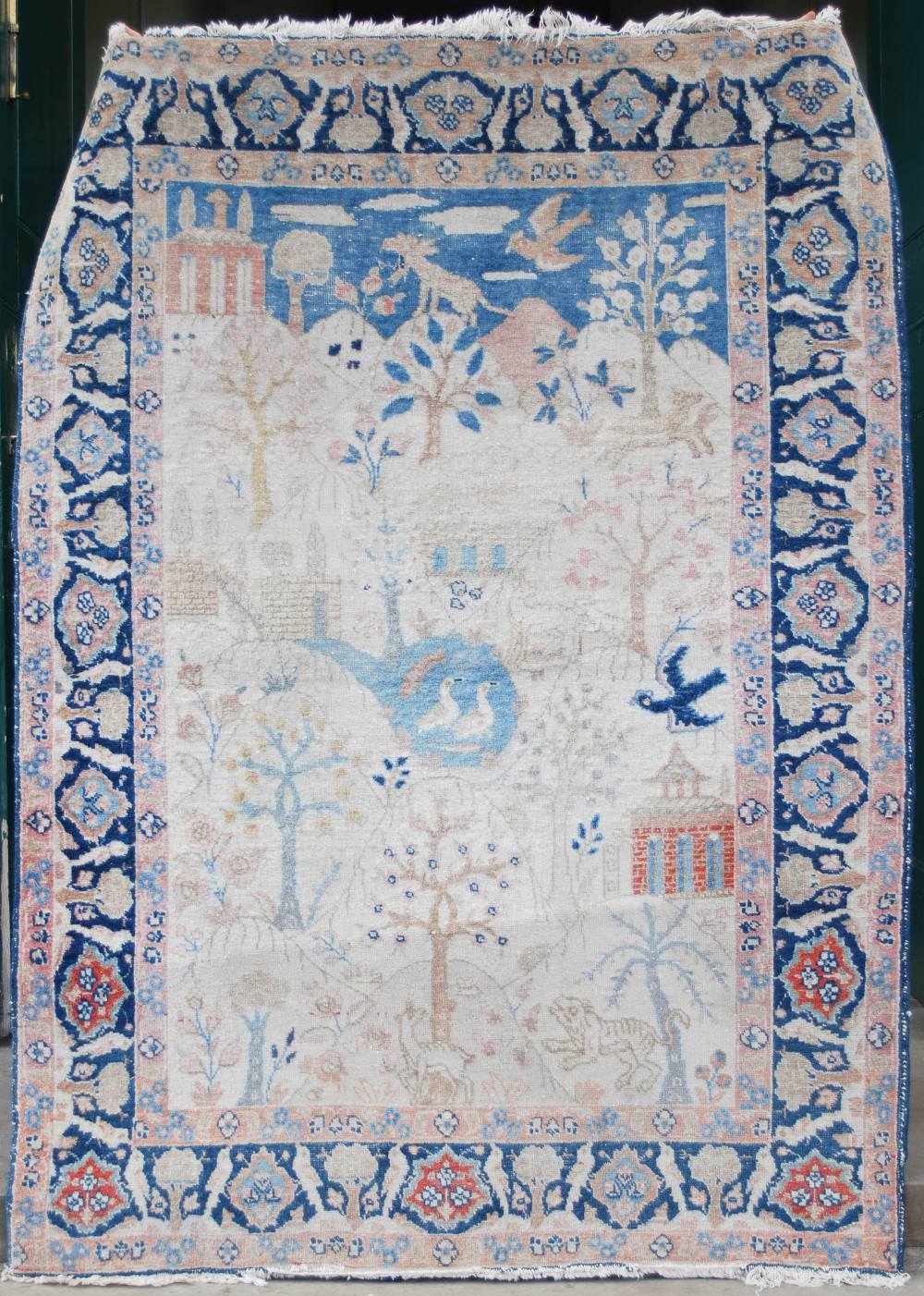 A PERSIAN RUG, LATE 19TH / EARLY 20TH CENTURY, THE RECTANGULAR GROUND DECORATED WITH TREES, - Image 2 of 9