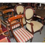 A GROUP OF FIVE CHAIRS TO INCLUDE THREE OAK DINING CHAIRS WITH UPHOLSTERED DROP IN SEATS, TOGETHER