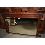 A LATE 19TH / EARLY 20TH CENTURY STAINED OAK OVERMANTLE MIRROR