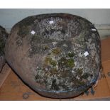 A LARGE QUERN-STONE OF OVOID FORM, APPROX. 40CM HIGH X 57CM WIDE