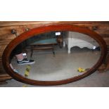 AN ANTIQUE MAHOGANY OVAL WALL MIRROR, APPROX. 65CM HIGH X 96CM WIDE