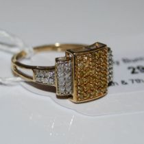 A 9CT GOLD YELLOW AND WHITE DIAMOND ART DECO STYLE RING, CENTRED WITH A RECTANGULAR SHAPED PANEL