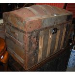 A WOOD AND METAL BOUND DOME TOP STORAGE TRUNK