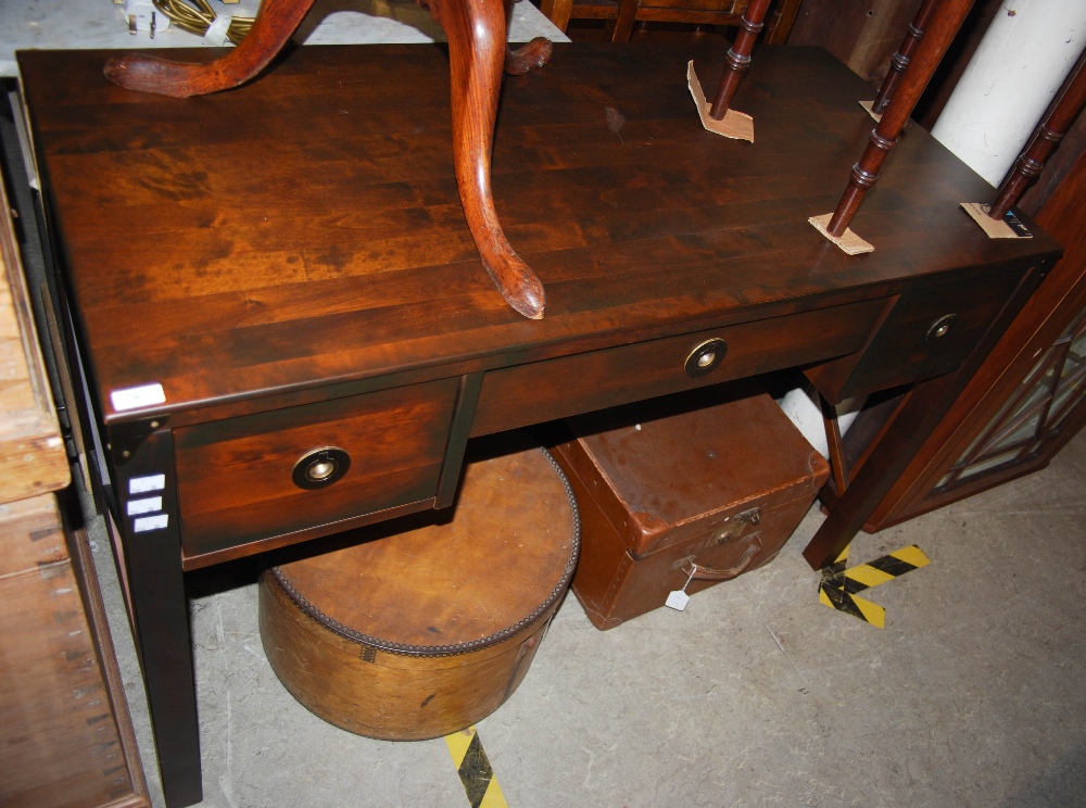 A LAURA ASHLEY KNEEHOLE DESK, CENTRED WITH FALL FRONT DRAWER AND FLANKED BY TWO DRAWERS