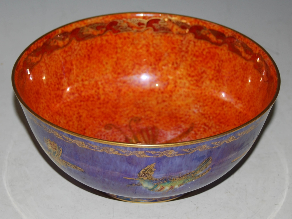 AN EARLY 20TH CENTURY WEDGWOOD BLUE GROUND LUSTRE BOWL DECORATED WITH BIRDS OF PARADISE, PRINTED